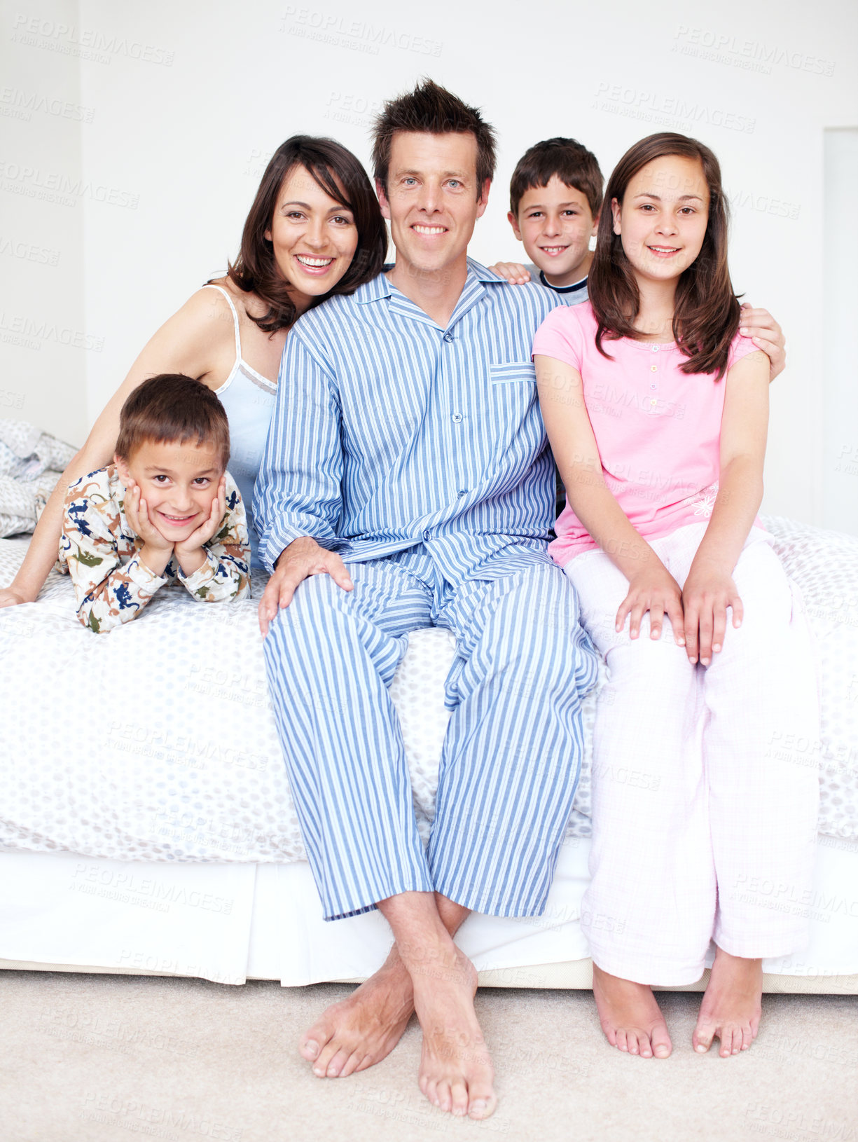 Buy stock photo Bedroom, pajamas and portrait of happy family with kids in home for support, love or wellness. Smile, mother or father with boys children and siblings for bonding together with parents in morning