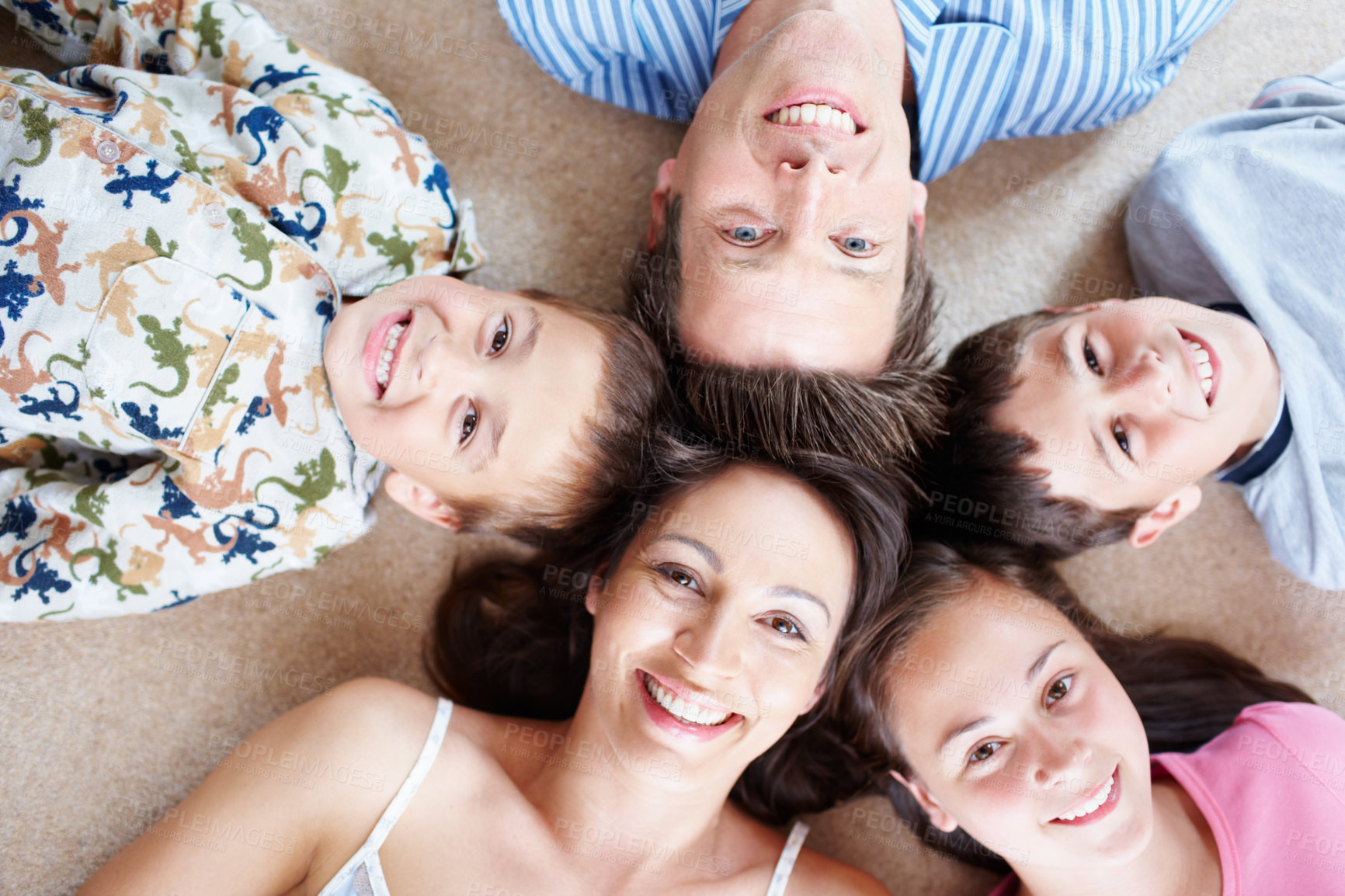 Buy stock photo Above, pajamas or portrait of happy family with siblings in home for support, love or wellness. Smile, mother or dad on floor with boys, children and kids for bonding together with girl in morning