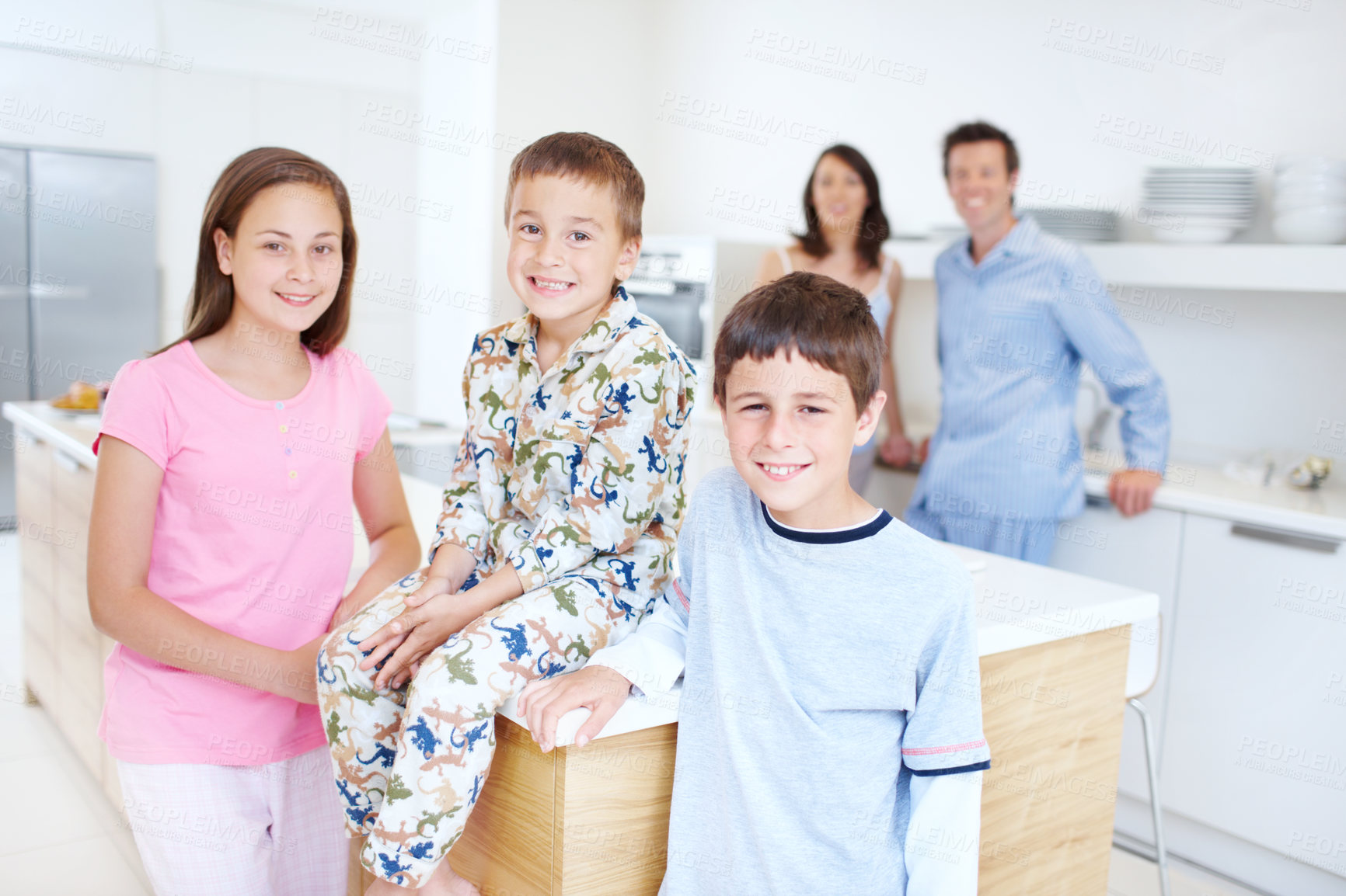 Buy stock photo Happy, kitchen and portrait of children with parents in home for bonding, connection and family time. Smile, love and kid siblings with mother and father for care together at house in Germany.