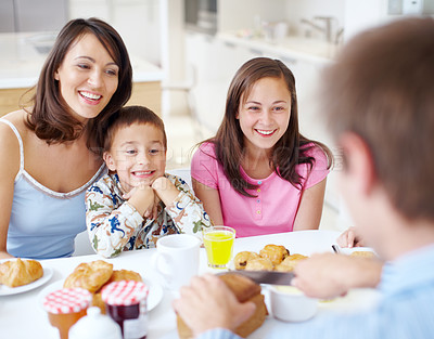 Buy stock photo Happy family, morning and breakfast with children at dining table for meal, snack or bread at home. Mother, father and kids or siblings with smile for weekend, holiday or bonding in brunch at house