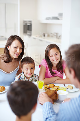 Buy stock photo Family, happy and morning breakfast in home, dining table and support with eating healthy food. Parents, children and talking together in kitchen with meal, love and brunch nutrition for bonding