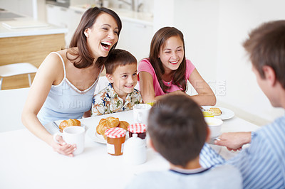 Buy stock photo Family, laughing and morning breakfast in home, dining table and support with eating healthy food. Parents, children and funny conversation in kitchen with meal, love and brunch nutrition for bonding