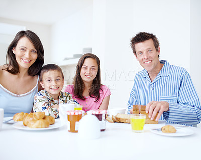 Buy stock photo Family, portrait and morning for breakfast in home, dining table and support with eating healthy food. Parents, kids and talking together in kitchen with meal, love and brunch nutrition for bonding