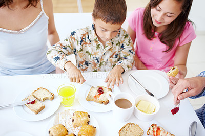 Buy stock photo Home, family and child with bread for breakfast, ingredients or meal preparation in morning by above. Table, people and boy with food for nutrition, jam sandwich or development with learning in house