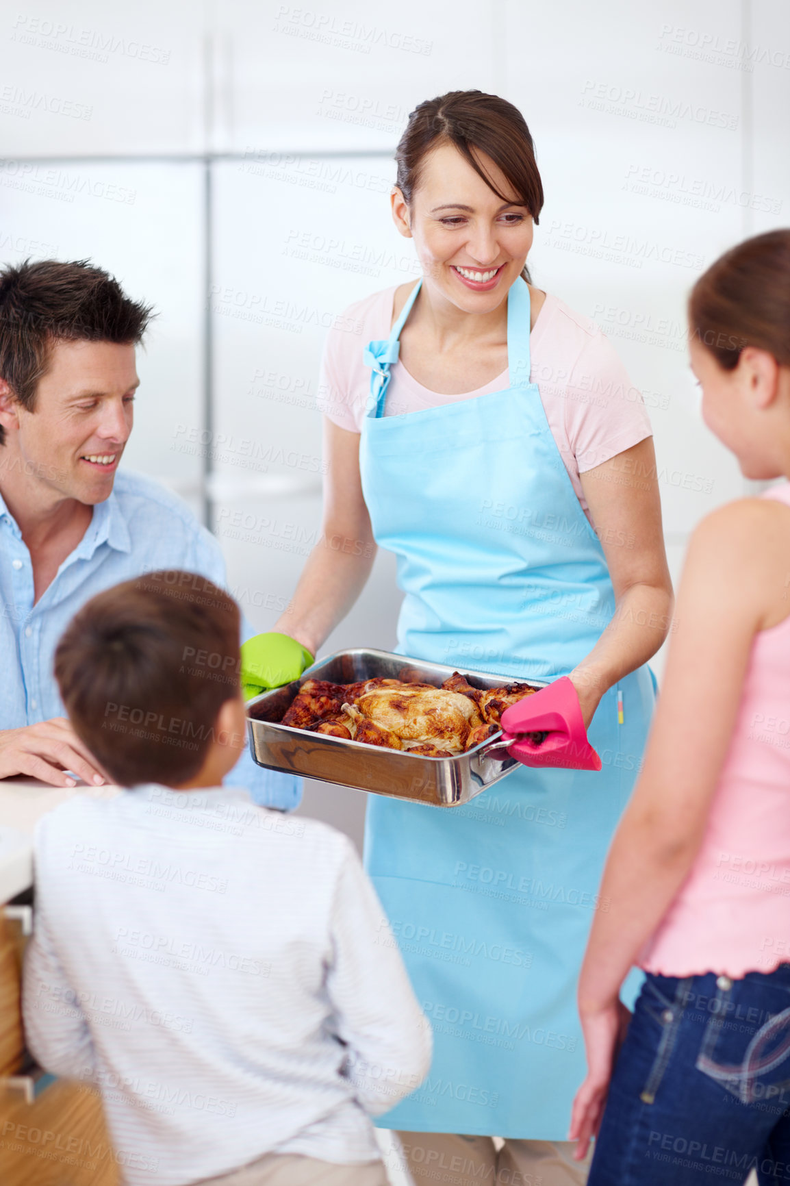 Buy stock photo Parents, kids and happy for food in kitchen with love, cooking and excited for roast. Mother, father and children in home with chicken, family lunch preparation or smile for Thanksgiving celebration