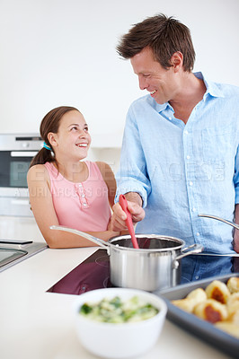 Buy stock photo Home, child and father with pot for cooking, ingredients and food preparation with smile in kitchen. Happy family, papa and girl with bonding for culinary meal, nutrition and kid for support by stove