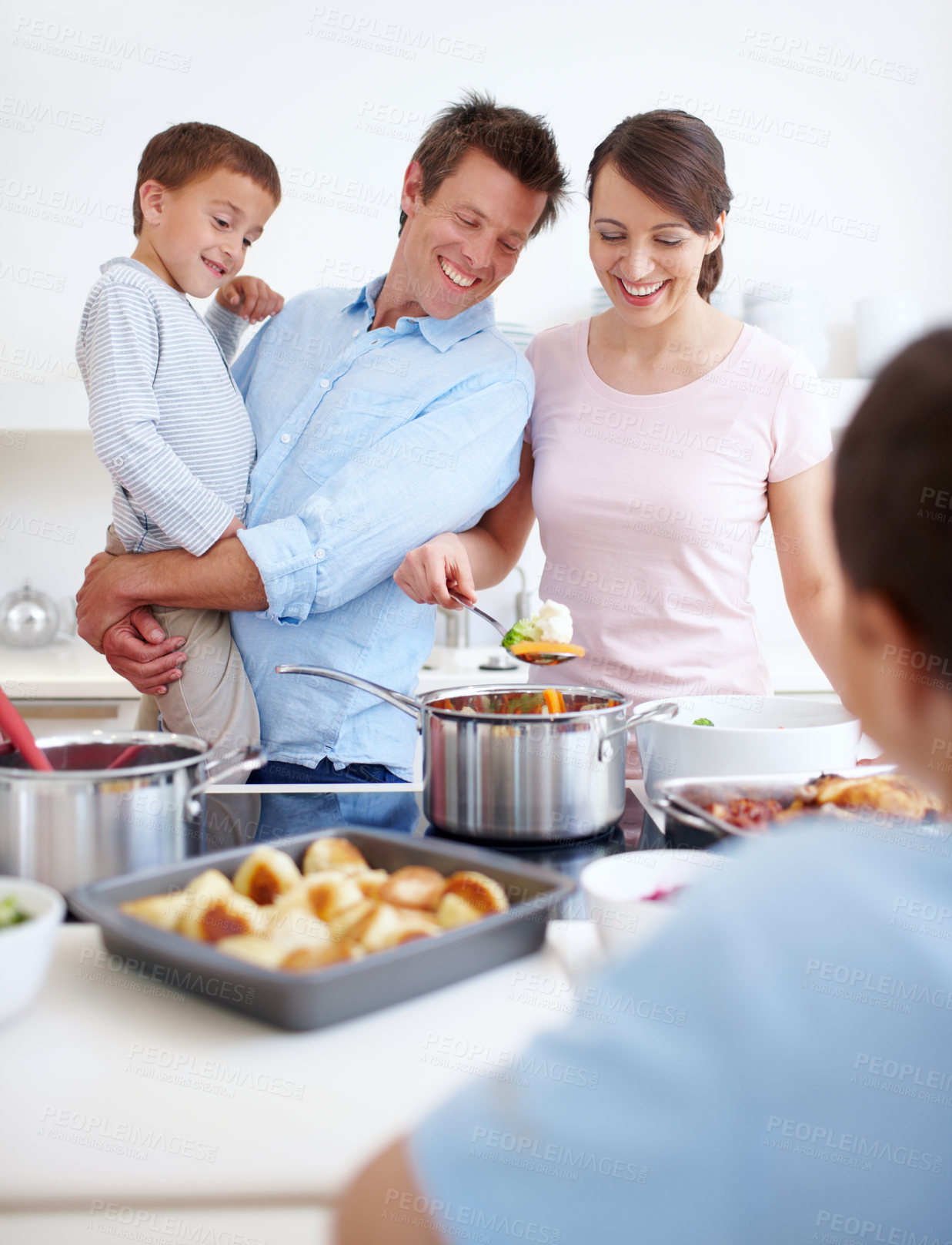 Buy stock photo Family, happy and cooking in kitchen with support, Thanksgiving celebration and love. Parents, children and excited in home for meal preparation, nutritional lunch and smile in apartment for learning