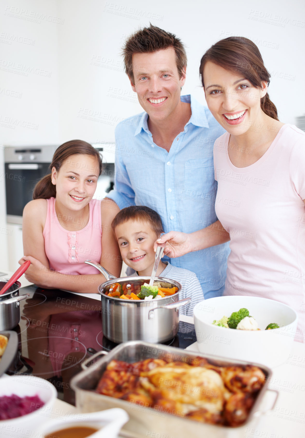 Buy stock photo Family, smile and cooking in kitchen with portrait, Thanksgiving celebration or support. Parents, kids and happy in home for vegetable preparation, nutritional lunch and excited at stove for learning