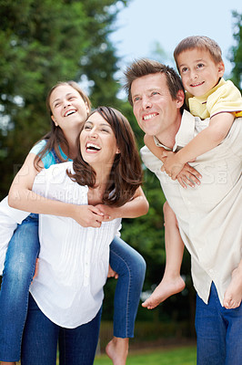 Buy stock photo Family, park and laugh outdoor with piggy back, game and smile with mom, dad and kids. Bonding, love and care with happy youth and hug in nature with trees, fun weekend and summer break in garden