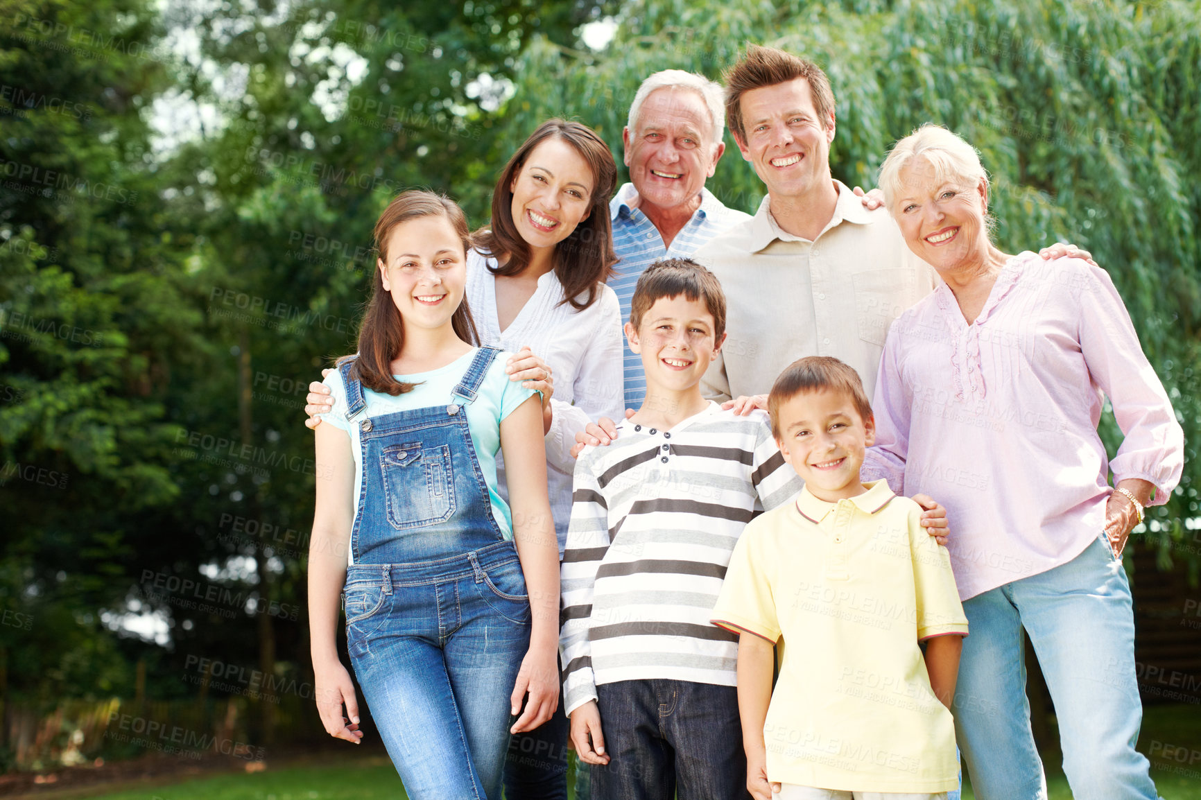 Buy stock photo Happy, portrait or big family with hug at park for holiday, weekend or bonding together. Grandparents, parents and children or kids with smile or generations for outdoor vacation or support in nature