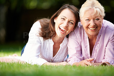 Buy stock photo Park, senior mother and woman in portrait with laughing, connection and bonding together as family. Happy people, mom and adult daughter with smile for joke, security and love on holiday in Sydney