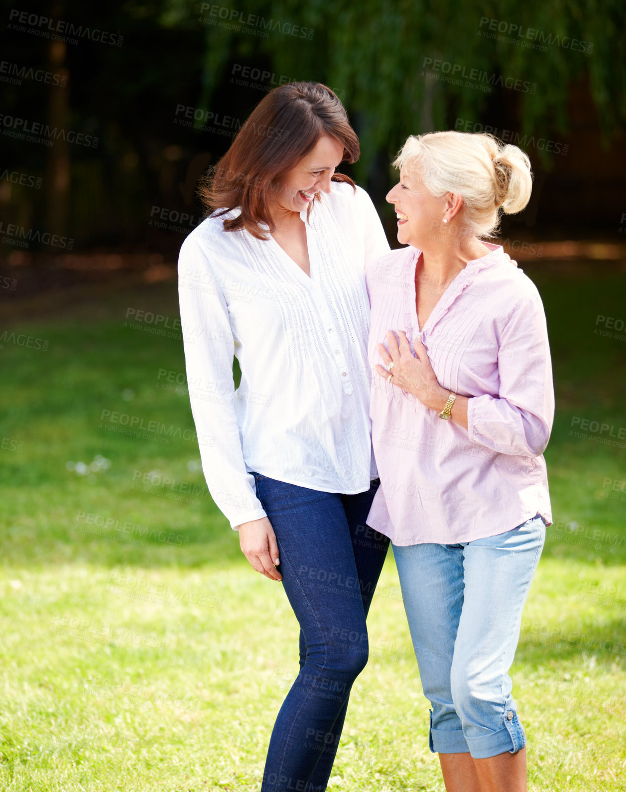 Buy stock photo Laughing, senior mother and woman in park with hug, connection and bonding together as family. Happy people, mom and adult daughter with smile for memory, security or love embrace on holiday vacation