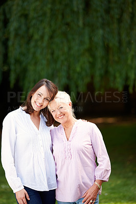 Buy stock photo Park, senior mother and woman in portrait with hug, connection and bonding together as family. Happy people, mom and adult daughter with smile for memory, security and love on holiday in Australia