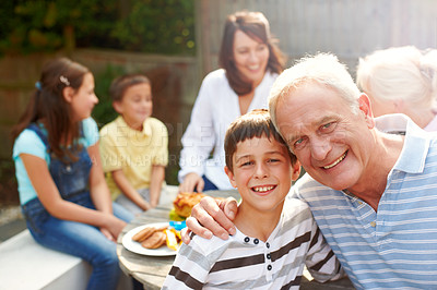 Buy stock photo Backyard, grandfather and child in portrait for hug, connection or bonding together with lunch. Happy people, senior man and joyful boy with smile for love embrace, security or trust for brunch snack