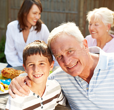 Buy stock photo Backyard, grandfather and child in portrait for lunch, connection and bonding together with smile. Happy people, senior man and joyful boy with hug for love embrace, security or trust for brunch meal