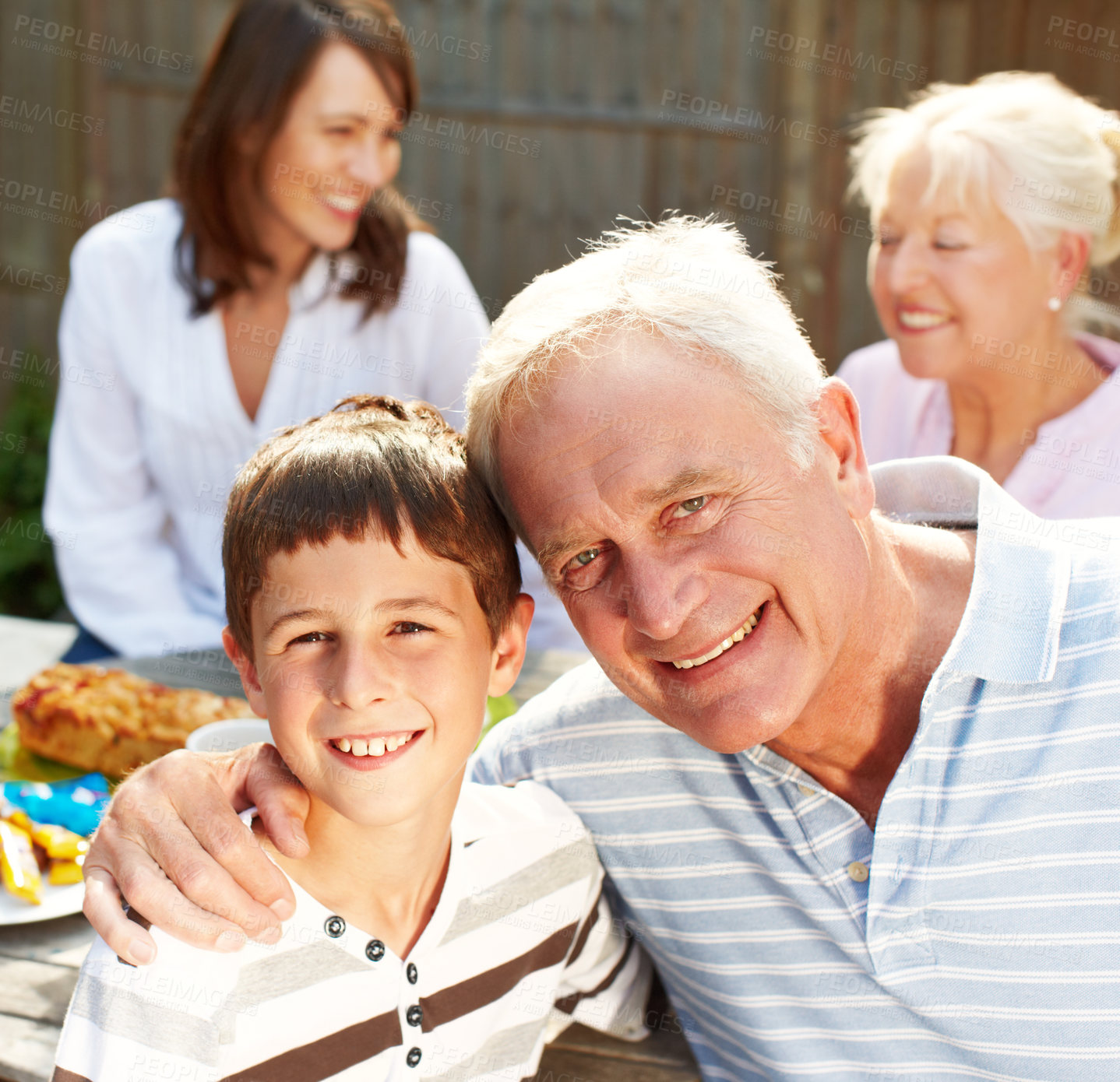 Buy stock photo Backyard, grandfather and child in portrait for lunch, connection and bonding together with smile. Happy people, senior man and joyful boy with hug for love embrace, security or trust for brunch meal