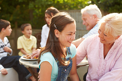 Buy stock photo Backyard, grandmother and child with laugh for love, connection and bonding together with lunch. Happy people, senior woman and girl with smile for hug embrace, security and trust for brunch snack