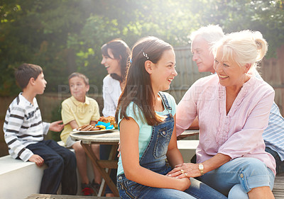 Buy stock photo Outdoor, grandma and child with laughing for love, connection and bonding together with lunch. Happy people, senior woman and girl with smile for care embrace, security and trust for brunch snack