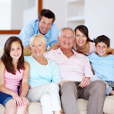 Buy stock photo Family, portrait and home with parents, children and grandparents together with care on sofa. Generations, happy and smile with love, bonding and support with hug relax in living room on weekend