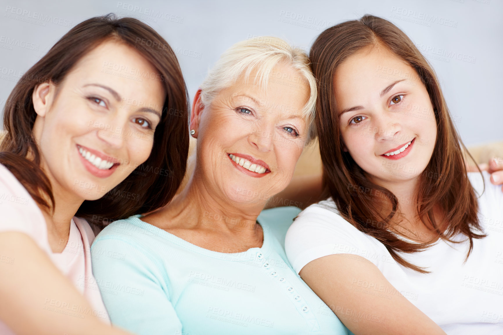 Buy stock photo Family, portrait and home with women, girl and grandmother together with care on sofa. Female generations, happy and smile with love, bonding and support with hug and relax in living room on weekend