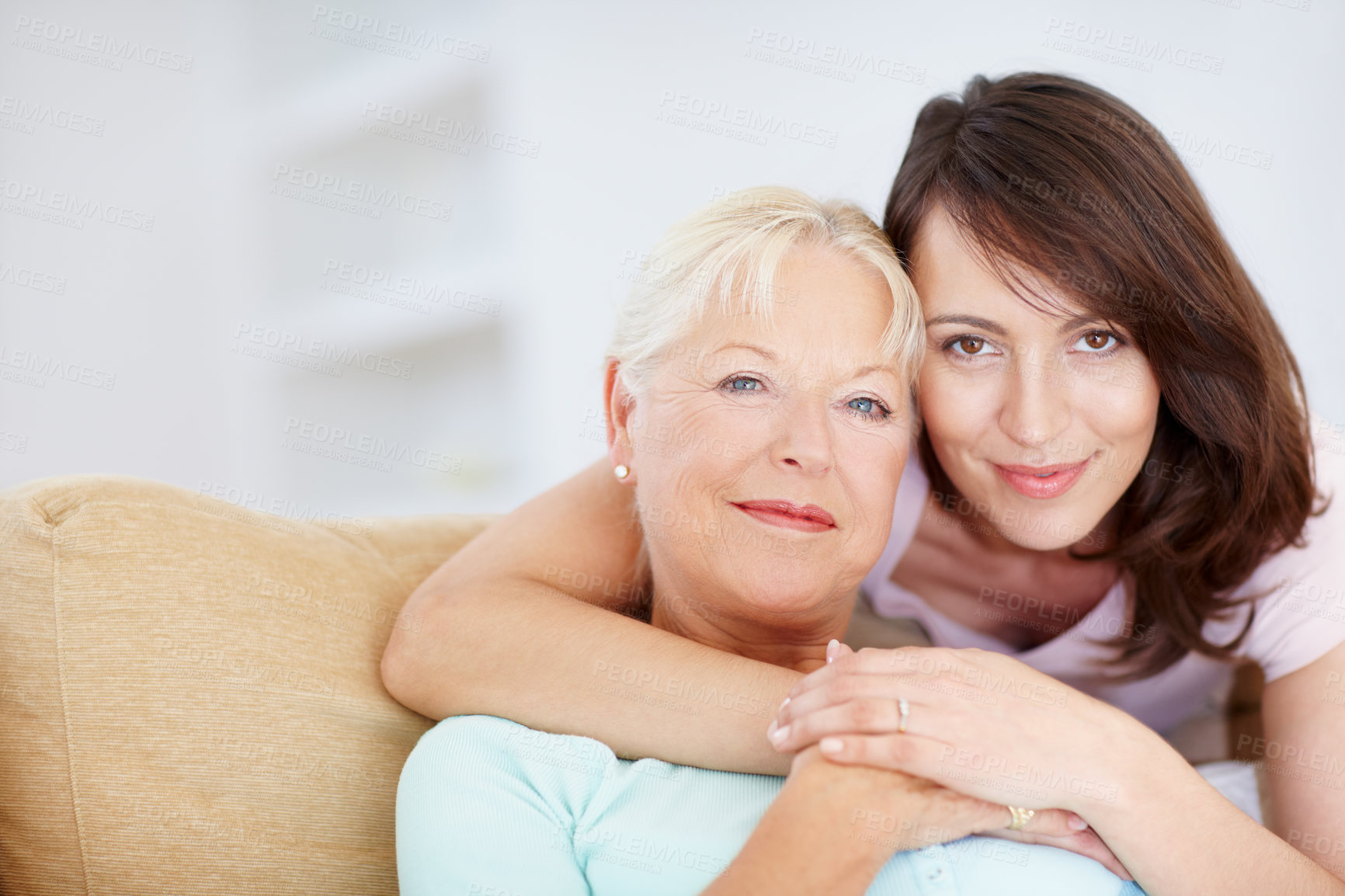 Buy stock photo A loving daughter embracing her mother - Copyspace