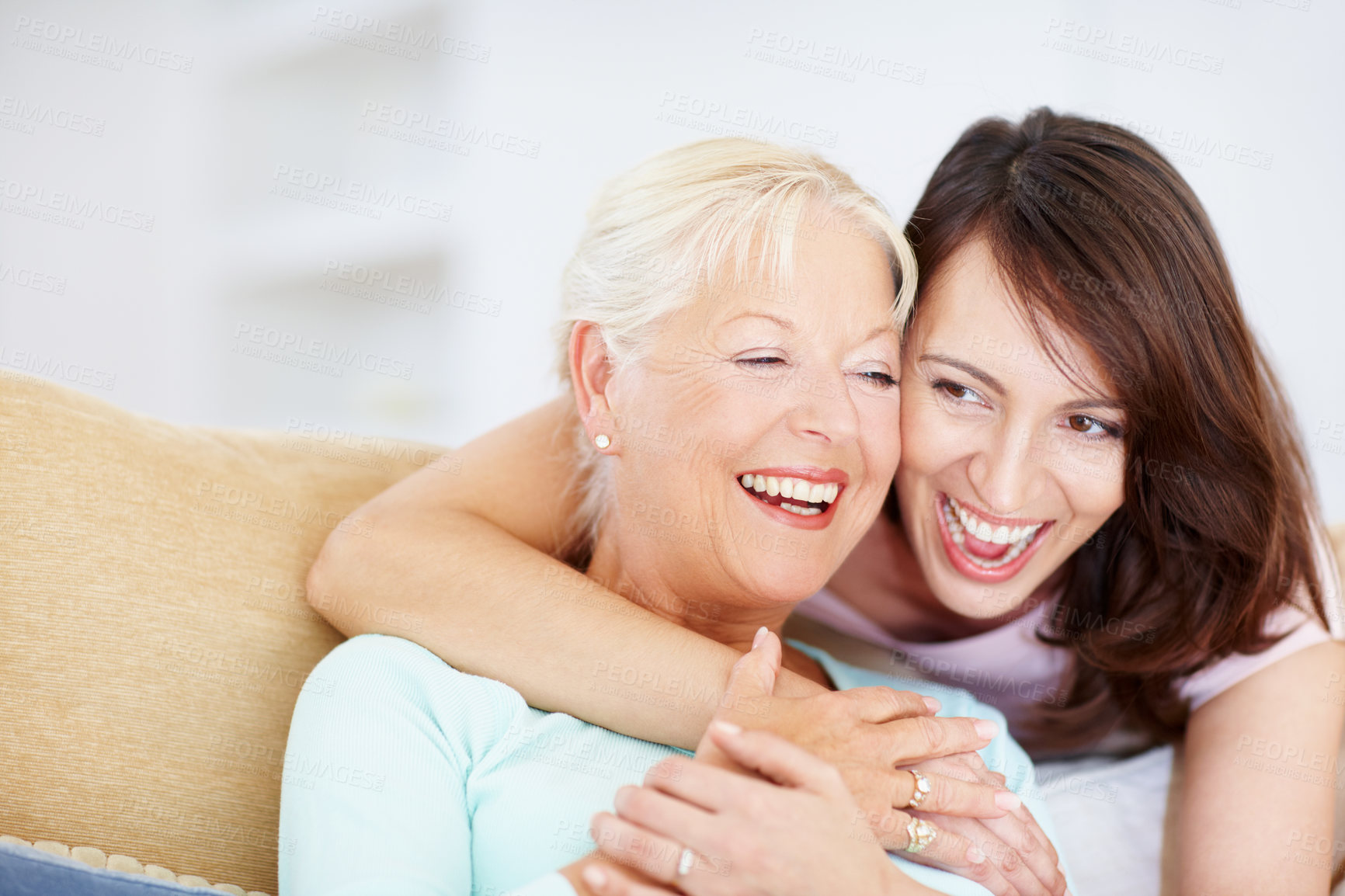 Buy stock photo Happy, women and laugh portrait of hug, senior mother and daughter in home with bonding. Generations, care and weekend on living room couch with family, support and love in lounge with embrace 