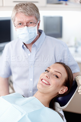 Buy stock photo Portrait of mature doctor with smiling patient in clinic