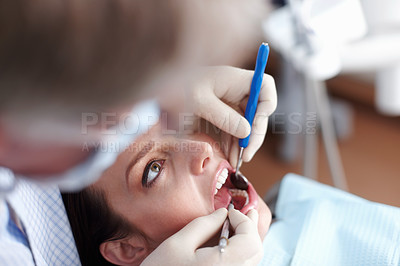 Buy stock photo High angle view of dentist checking patient's teeth