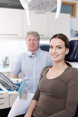 Buy stock photo Portrait of smiling female patient with dentist at clinic