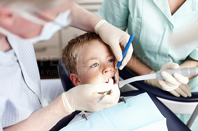 Buy stock photo Portrait of dentist cleaning teeth of young patient for healthy teeth