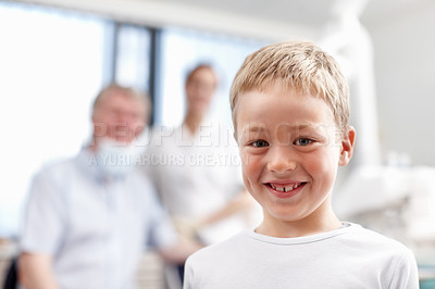 Buy stock photo Portrait of adorable young boy smiling with dentists in background