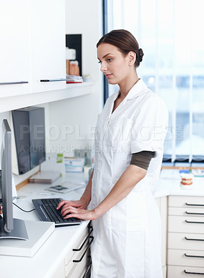 Buy stock photo Portrait of female dentist working on computer in office