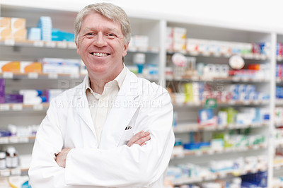 Buy stock photo Portrait of confident pharmacist smiling with hands folded at drugstore