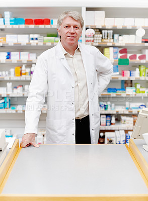 Buy stock photo Man, reading and pharmacist with confidence at dispensary for medication, supplements or pills. Chemist, inventory and mature male apothecary in medical clinic for medicine or tablets in drug store.