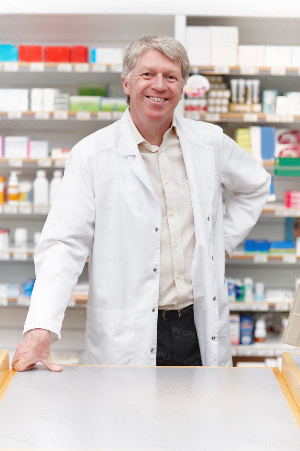 Buy stock photo Happy man, pharmacist and portrait at counter for healthcare, friendly welcome and service. Mature chemist, smile and confident in pharmacy for medicine dispensary, assistance and support in Canada