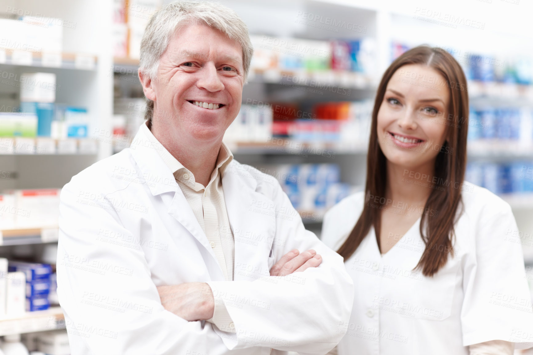 Buy stock photo People, pharmacist and happy on portrait at pharmacy with pride for teamwork or collaboration in Germany. Mature man, woman and employees with smile or satisfied with confidence for medication