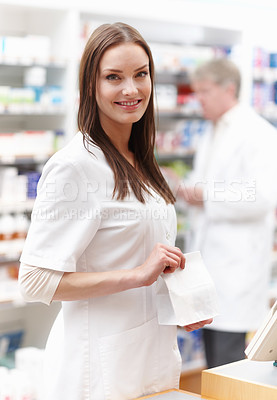 Buy stock photo Portrait of beautiful professional smiling with male doctor in background