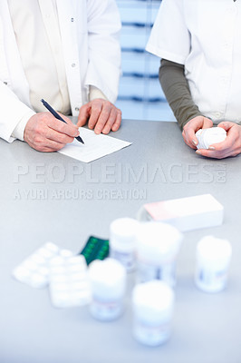 Buy stock photo Writing prescription, hands and pharmacist with medicine, people and notebook for treatment. Employees, closeup and medical with professional, healthcare and inventory with tablets and check stock