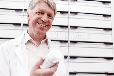 Buy stock photo Happy man, pills and portrait of mature pharmacist with medicine, vitamins and drugs for healthcare. Face, medical retailer and confident chemist with smile for medication product, treatment or stock