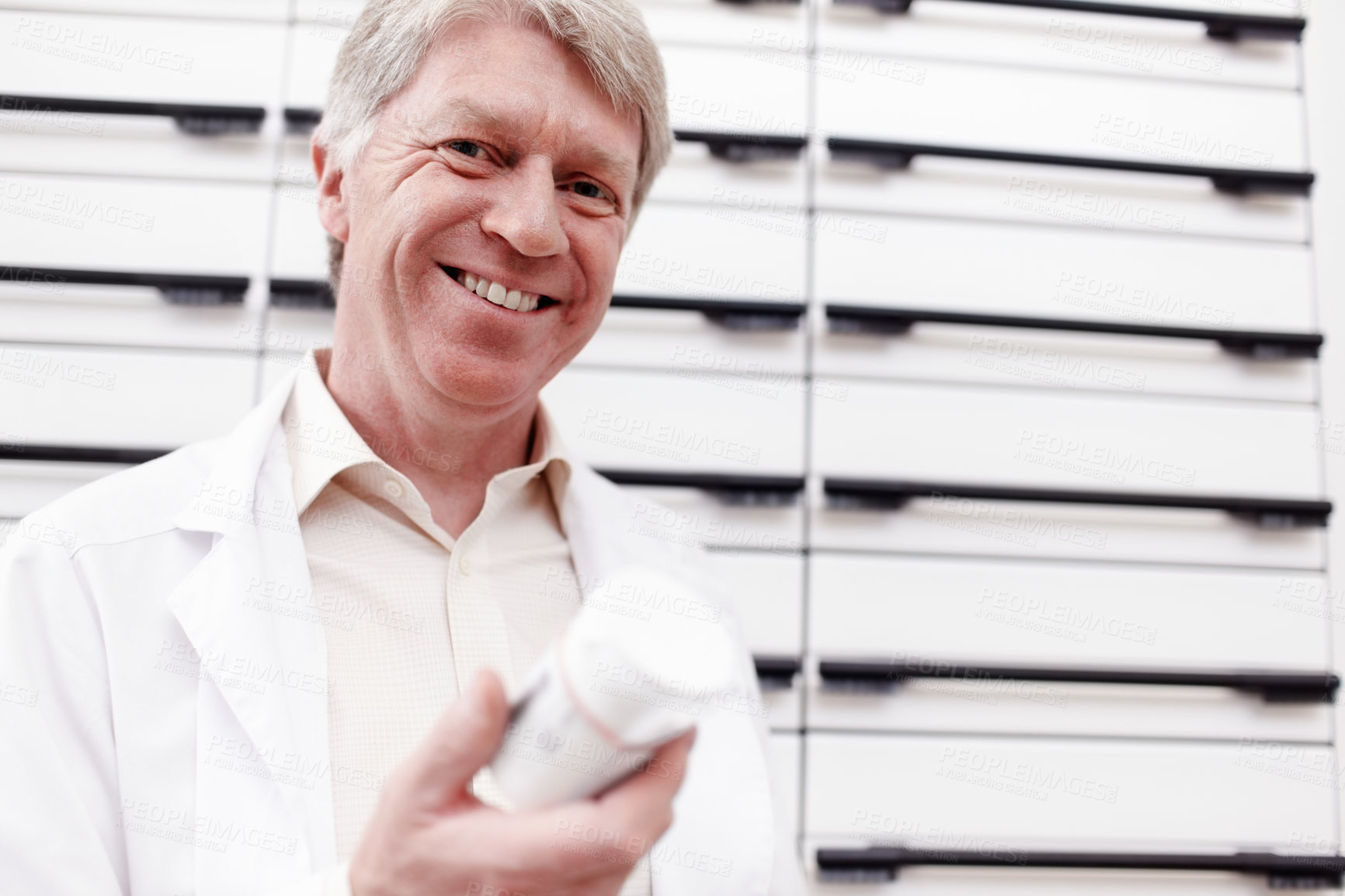 Buy stock photo Happy man, pills and portrait of mature pharmacist with medicine, vitamins and drugs for healthcare. Face, medical retailer and confident chemist with smile for medication product, treatment or stock