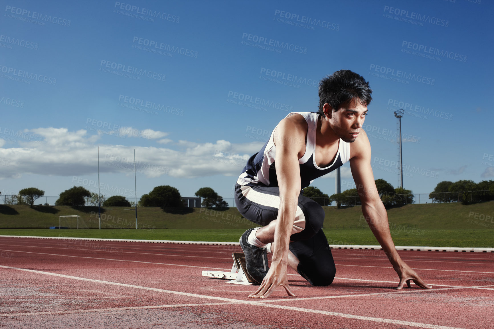 Buy stock photo Runner, start and man with fitness, training and ready with energy, exercise and routine. Person, athlete and healthy guy on track, sports and workout with wellness, goals and marathon with challenge