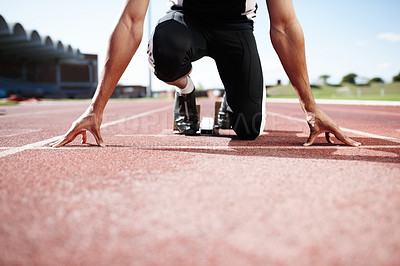 Buy stock photo Fitness runner, hands and start block at stadium race track, sports or professional athlete training. Field, ready and man prepared for sprint competition, speed or fast performance outdoor on ground