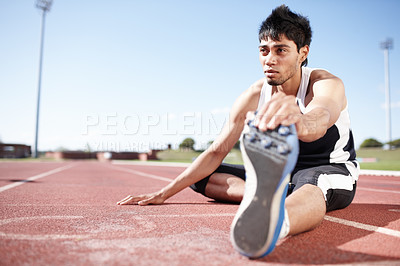 Buy stock photo Man, ground and stretching legs on running track, warm up and preparation for exercise or workout. Male person, muscle relief and outdoor for fitness in sport, athlete and ready for marathon training