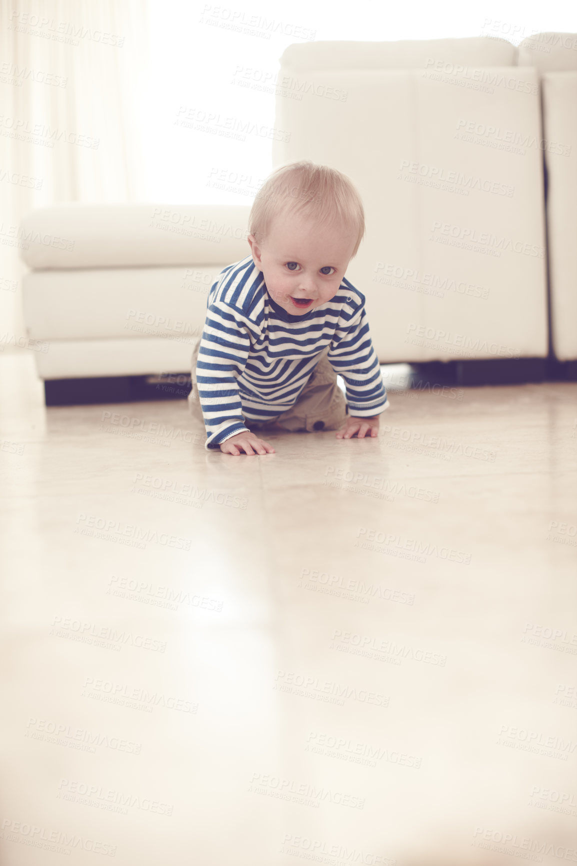 Buy stock photo A cute baby boy crawling on the floor at home