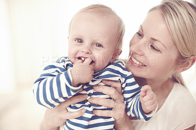 Buy stock photo Cropped view of a cute baby boy being held by his mother 
