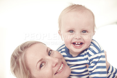 Buy stock photo Cropped view of a cute baby boy being held by his mother 