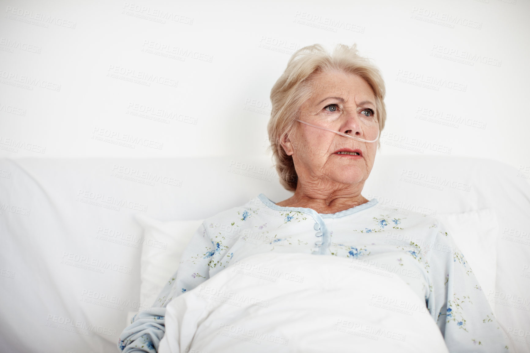 Buy stock photo Ailing senior woman looks away as she contemplates her illness - Copyspace