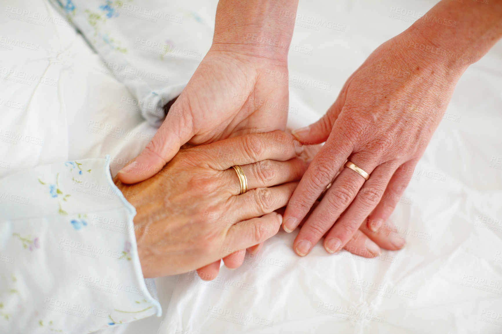 Buy stock photo Hands, closeup and senior people with comfort, support and compassion with empathy. Together, pensioner and elderly women with rings, sympathy and kindness with trust, emotions and gratitude