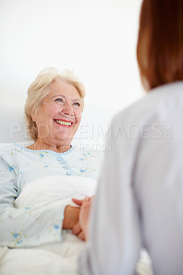 Buy stock photo Clinic, senior woman and doctor with holding hands for support, compassion and consultation in bed. Healthcare, happy elderly patient and caregiver with oxygen tube for pneumonia, asthma and recovery