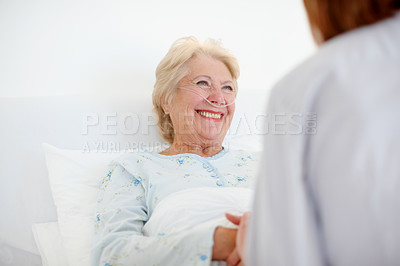 Buy stock photo Hospital, senior woman and doctor with support for recovery, compassion or consultation in bed. Healthcare, happy elderly patient and caregiver with oxygen tube for pneumonia, asthma or holding hands